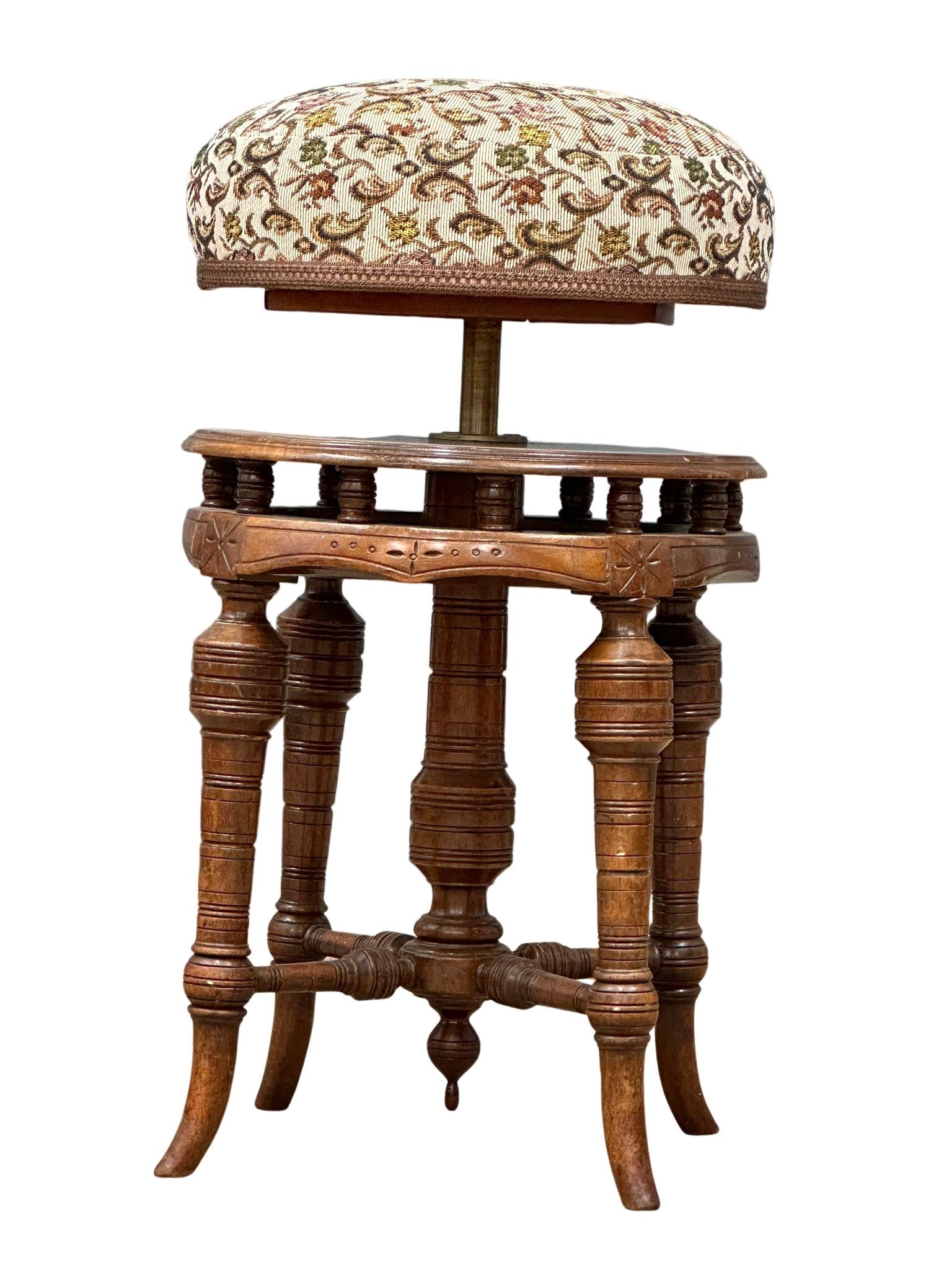 A late Victorian walnut revolving piano stool. Circa 1880-1890 - Image 3 of 5