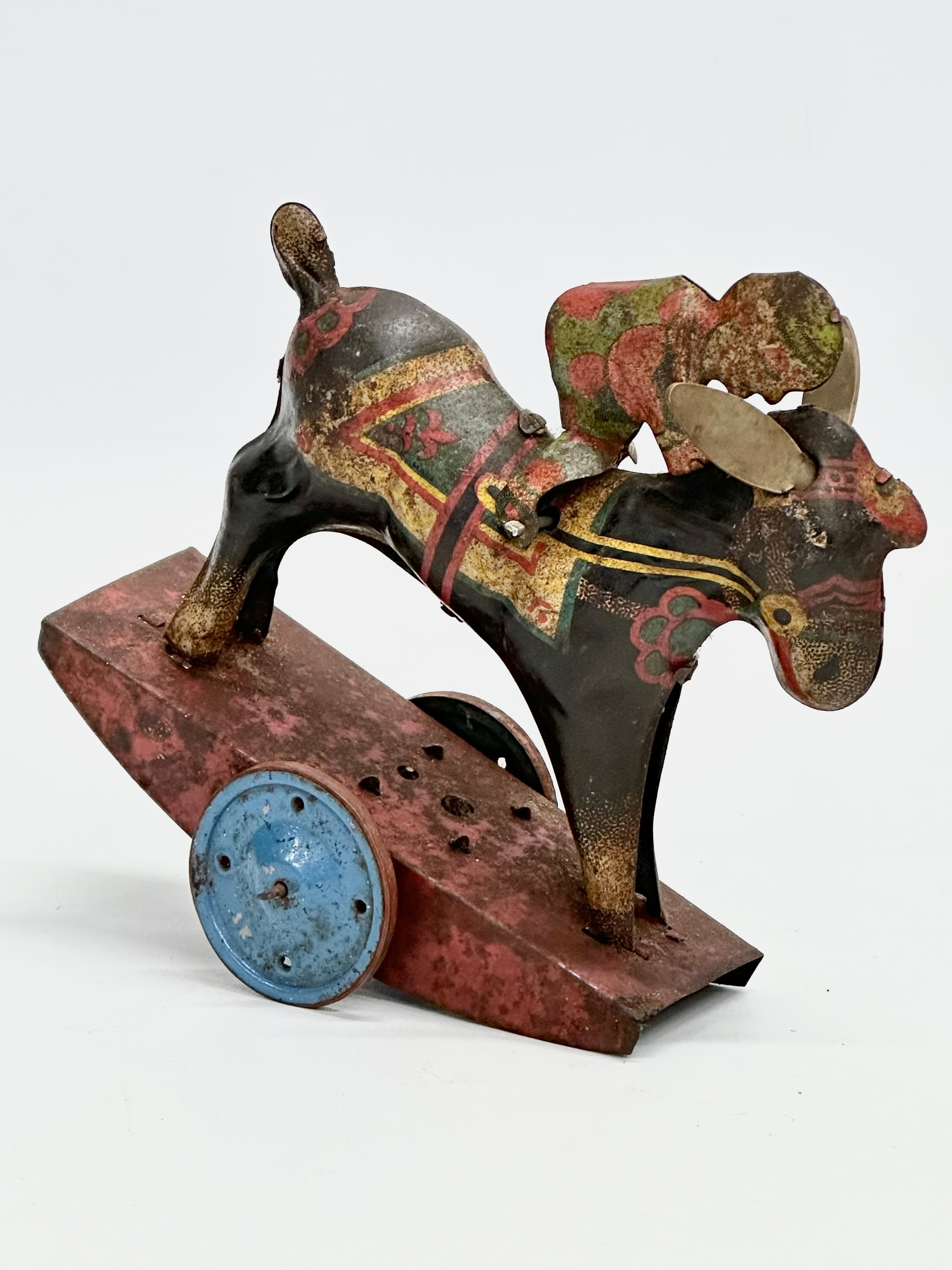 A vintage ‘Peter Pan’ series Stubborn mechanical rocking clown on horse. 15x17cm - Image 2 of 5