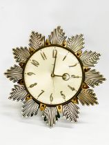 A 1960’s Mid Century Sunburst clock by Metamec. 32x32cm
