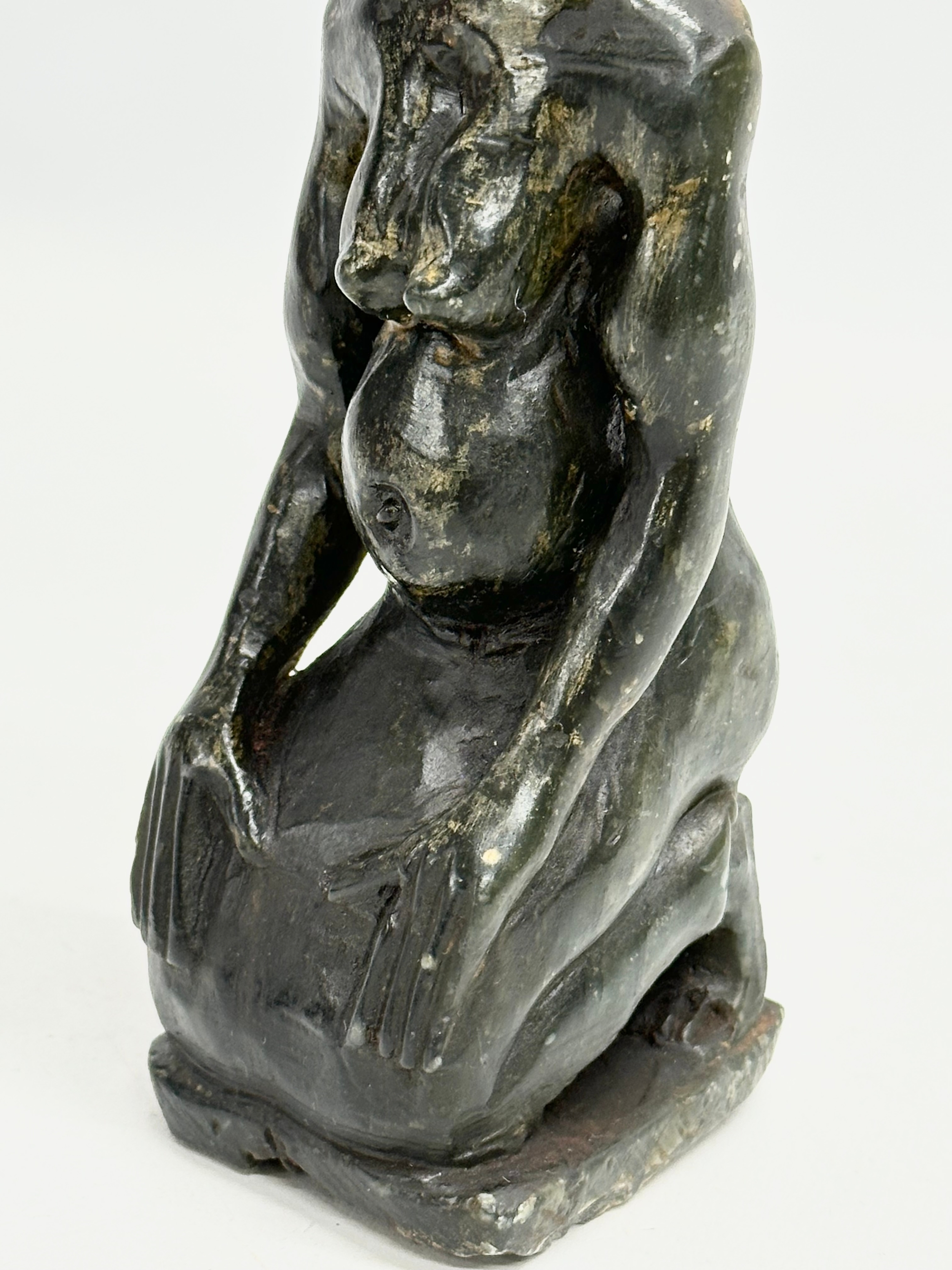 An early 20th century African painted stone figurine. 21cm - Image 3 of 5