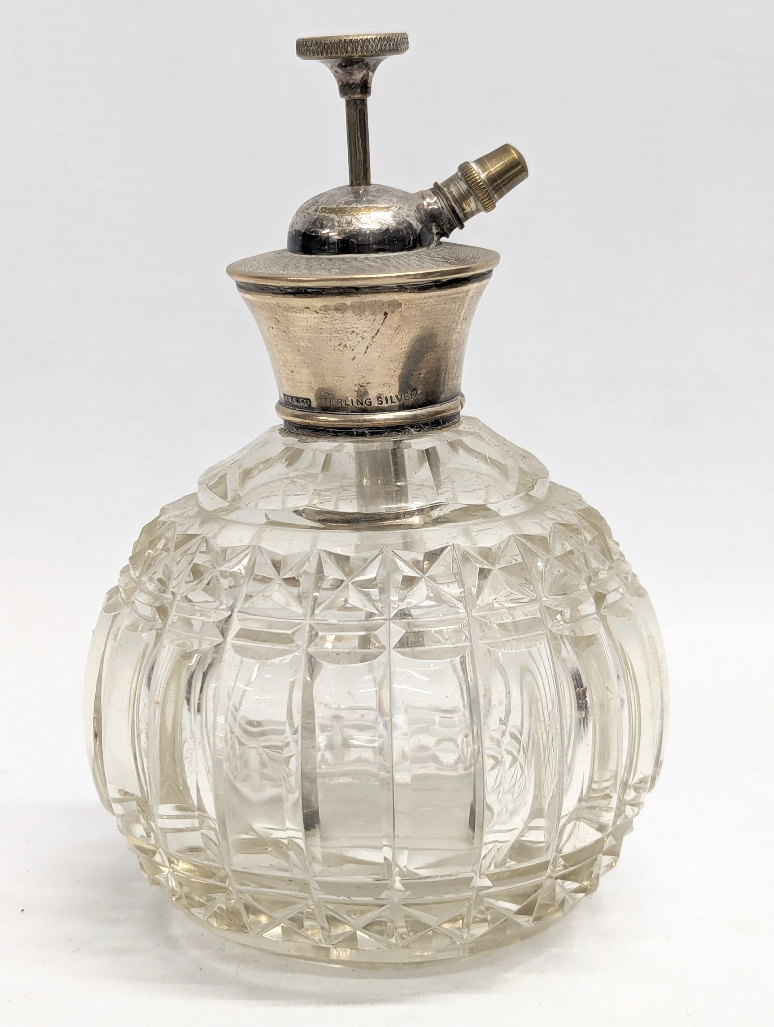 A sterling silver topped perfume bottle by W. G. Sothers Ltd. Birmingham, 1921-1961. 14cm