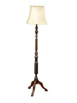 A mahogany standard lamp.