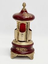 An Italian Rouge brass musical lipstick holder. 28cm