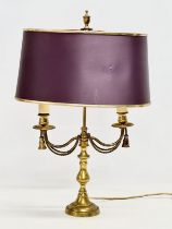 A brass table lamp with draped rope design. 38x28x58cm