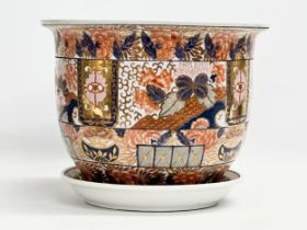 A large 20th Century Imari pattern jardiniere on stand. Makers stamp. 31x25cm.