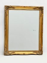 A Victorian style gilt framed mirror. 63x78cm