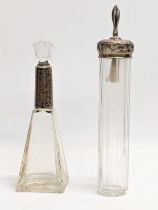 2 early 20th century silver and glass vanity bottles. Tallest 21cm
