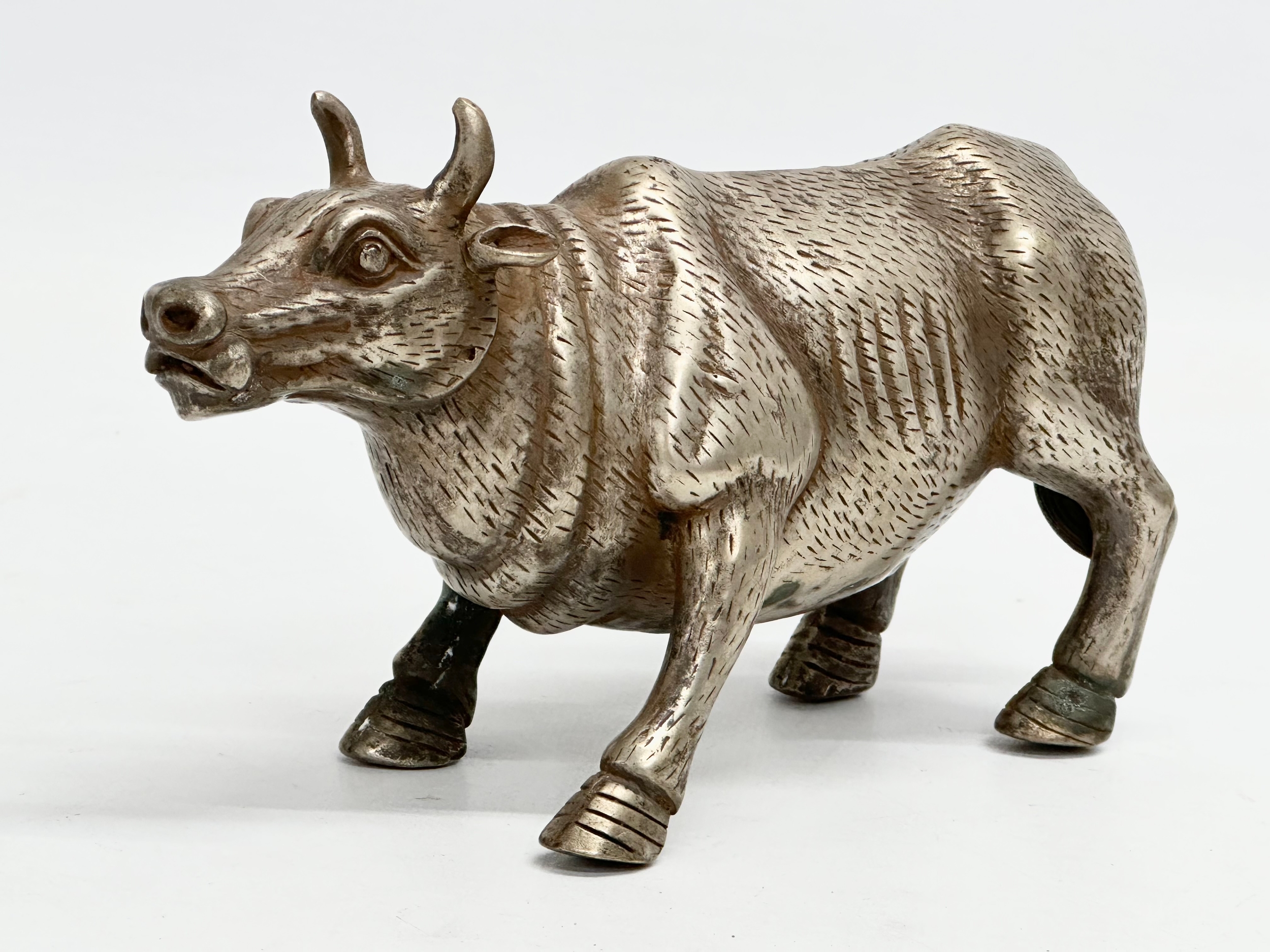 A 20th Century Chinese plated bull. 16.5cm