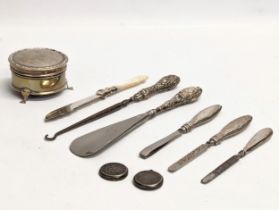 A quantity of early 20th century silver mounted cutlery, button hooks, shoe horn, etc.