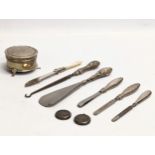 A quantity of early 20th century silver mounted cutlery, button hooks, shoe horn, etc.