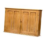 A large Late Victorian pine wall hanging 2 door cupboard with fitted shelves. Circa 1890. 114x23.