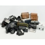 A collection of vintage cameras.