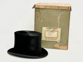 An early 20th century Austin Reid top hat with original box. Circa 1910-1920.