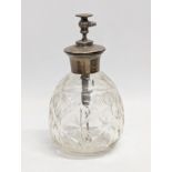 A sterling silver topped perfume bottle. 14cm