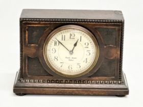 An Early 20th Century oak cased mantle clock by Riddels Limited, Belfast. French works. 21x8x14.5cm