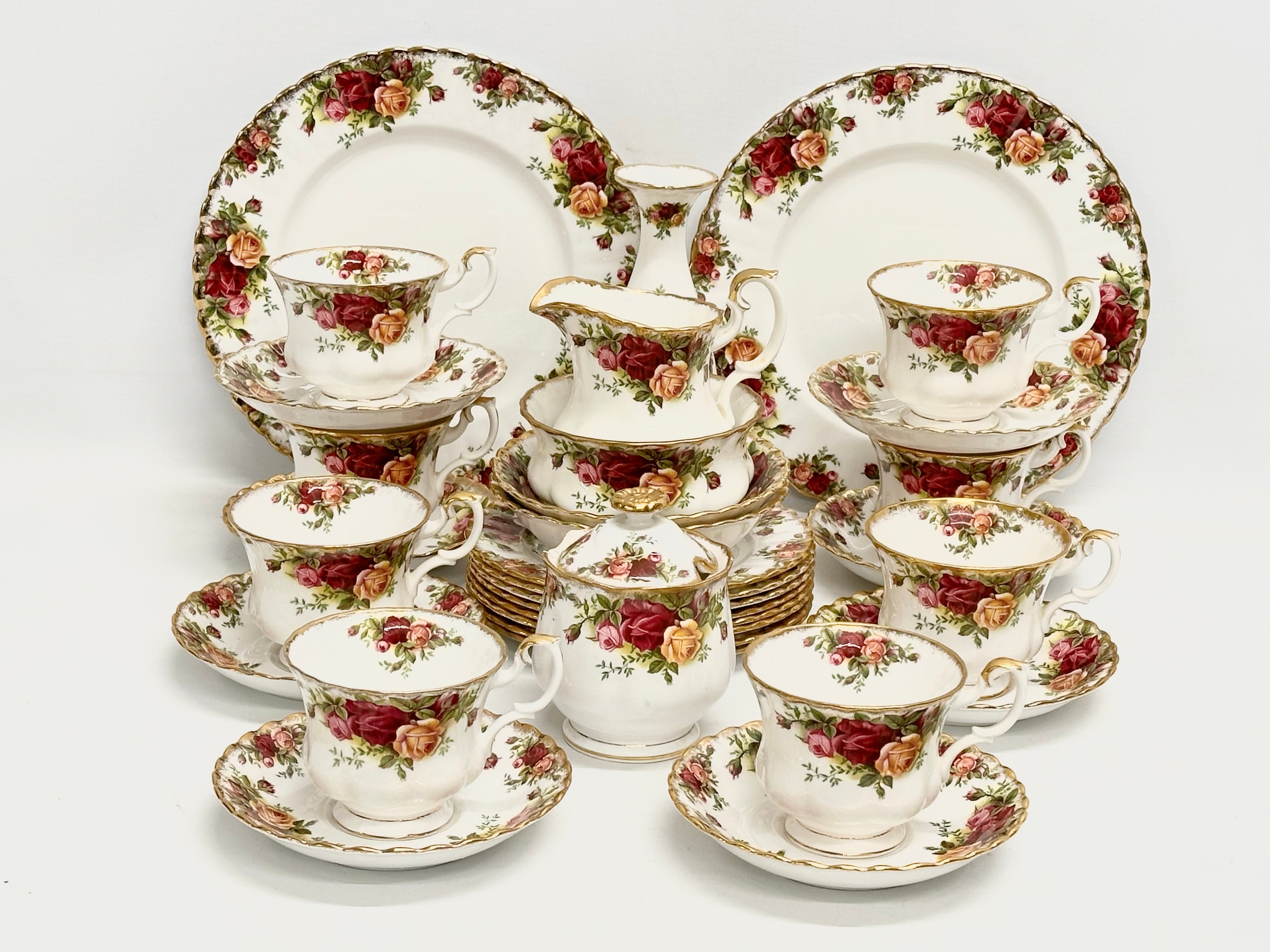 32 piece of Royal Albert ‘Old Country Roses’ tea service. 2 salad plates, a vase, sugar bowl with