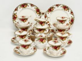 32 piece of Royal Albert ‘Old Country Roses’ tea service. 2 salad plates, a vase, sugar bowl with