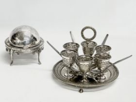 A Victorian silver plated breakfast set, egg cups and spoons on stand. Together with a silver plated