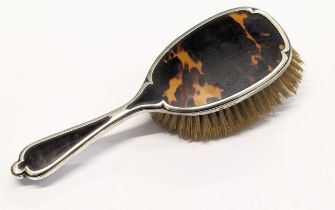 An early 20th century Art Deco silver rimmed / handled vanity brush by Richard Comyns. London, 1928.