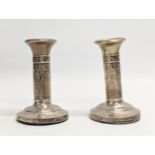 A quantity of early 20th century silver candlesticks. Tallest measures 14cm.