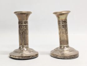 A quantity of early 20th century silver candlesticks. Tallest measures 14cm.