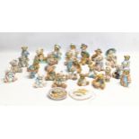 A collection of Cherished Teddies figures. Priscilla Hillman.