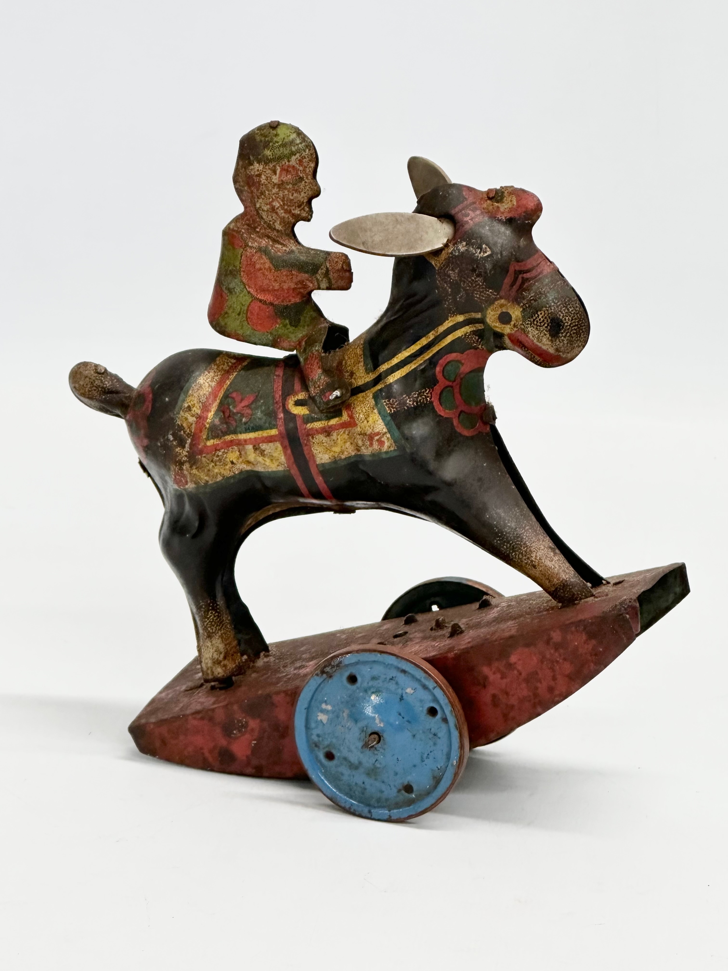 A vintage ‘Peter Pan’ series Stubborn mechanical rocking clown on horse. 15x17cm - Image 3 of 5