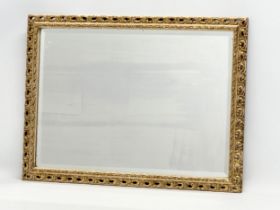 A mid 20th century gilt framed bevelled mirror. 62x47cm