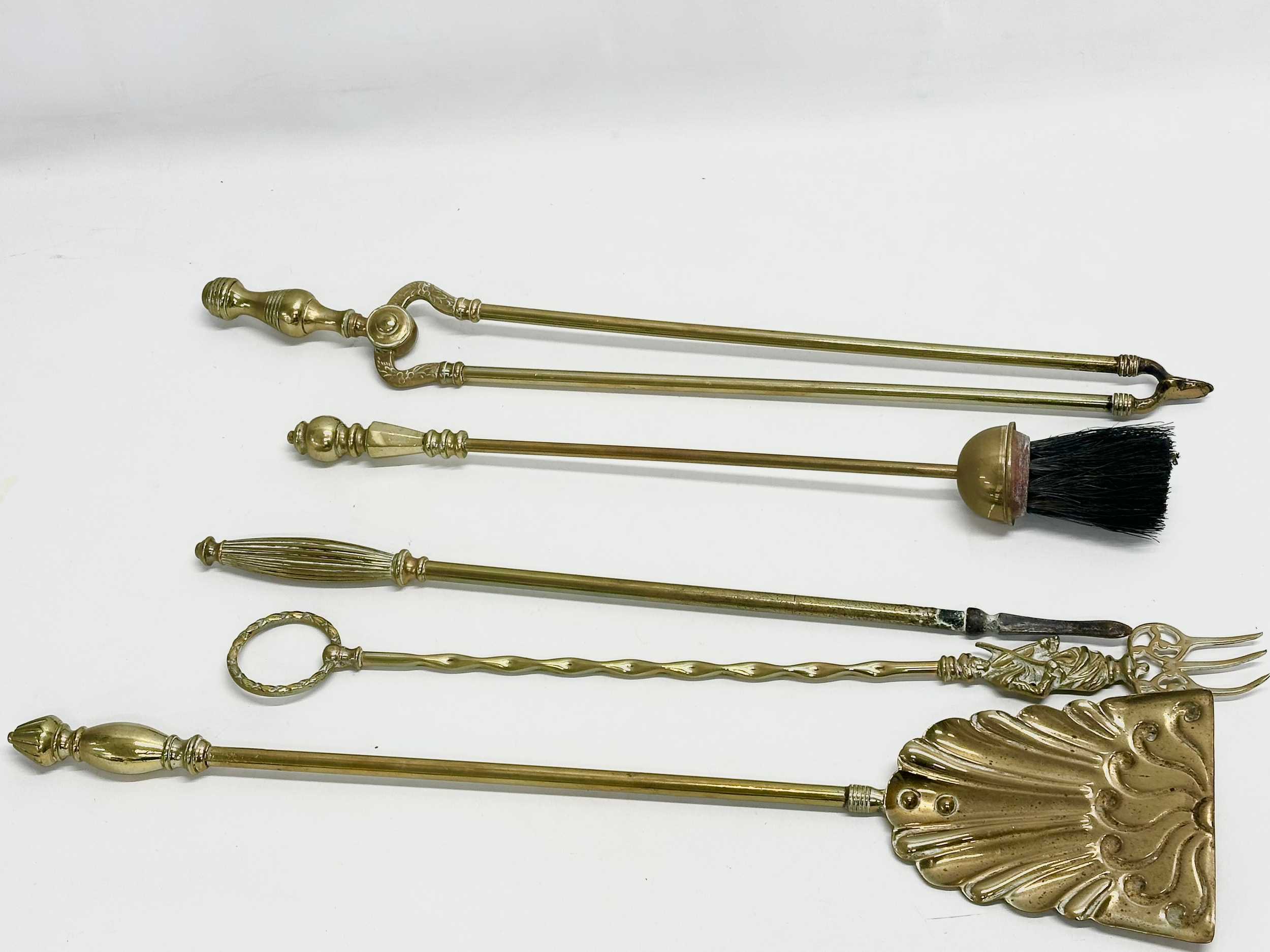 A quantity of Late Victorian brass fire tools and doorstops. A large Victorian brass companion set - Image 6 of 6