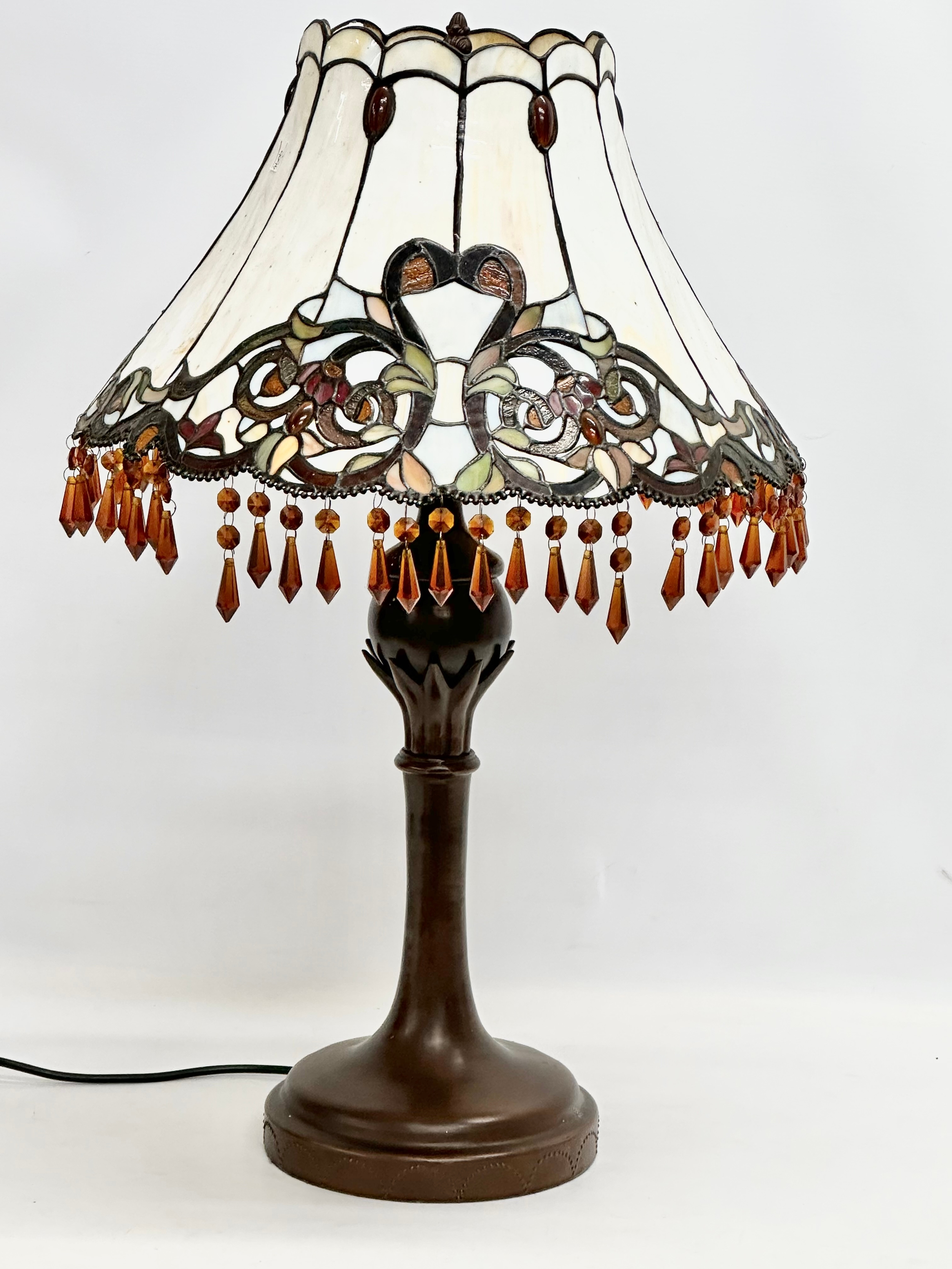 A large Tiffany style table lamp with amber glass droplets. 44x70cm