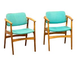 A pair of good quality Danish Mid Century teak armchairs.