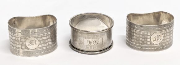 A pair of silver napkin rings by E J Trevitt & Sons. Chester. With other by Francis Howard Ltd,