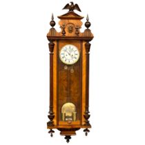 A large Victorian mahogany Vienna wall clock with weights, pendulum and key. 128cm