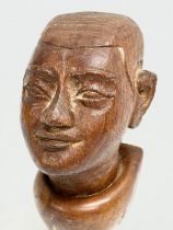 A 19th Century Burmese teak bust wall plaque. 18cm