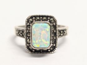 A silver Luke Stockley ring with opal stone. UK size P