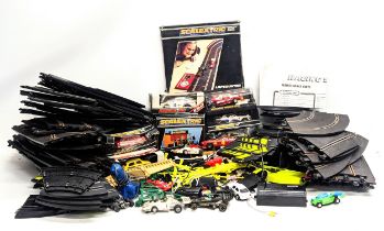 A large quantity of vintage Scalextric, including tracks, cars, etc. With 2 other racecar tracks.