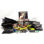 A large quantity of vintage Scalextric, including tracks, cars, etc. With 2 other racecar tracks.