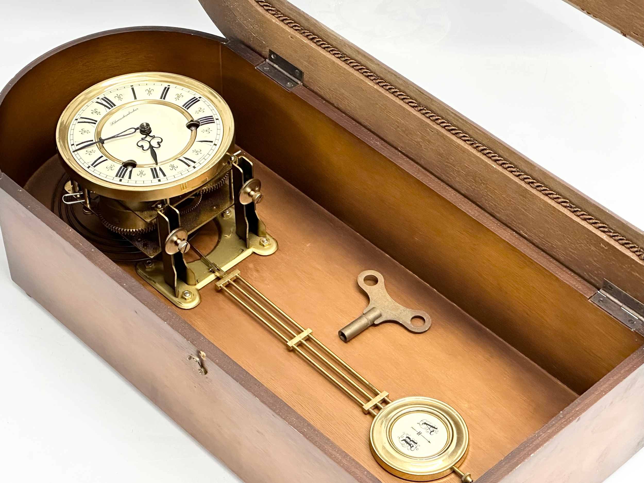 A 19th century style Schmeckenbecker wall clock. With key and pendulum. 63cm - Image 4 of 4