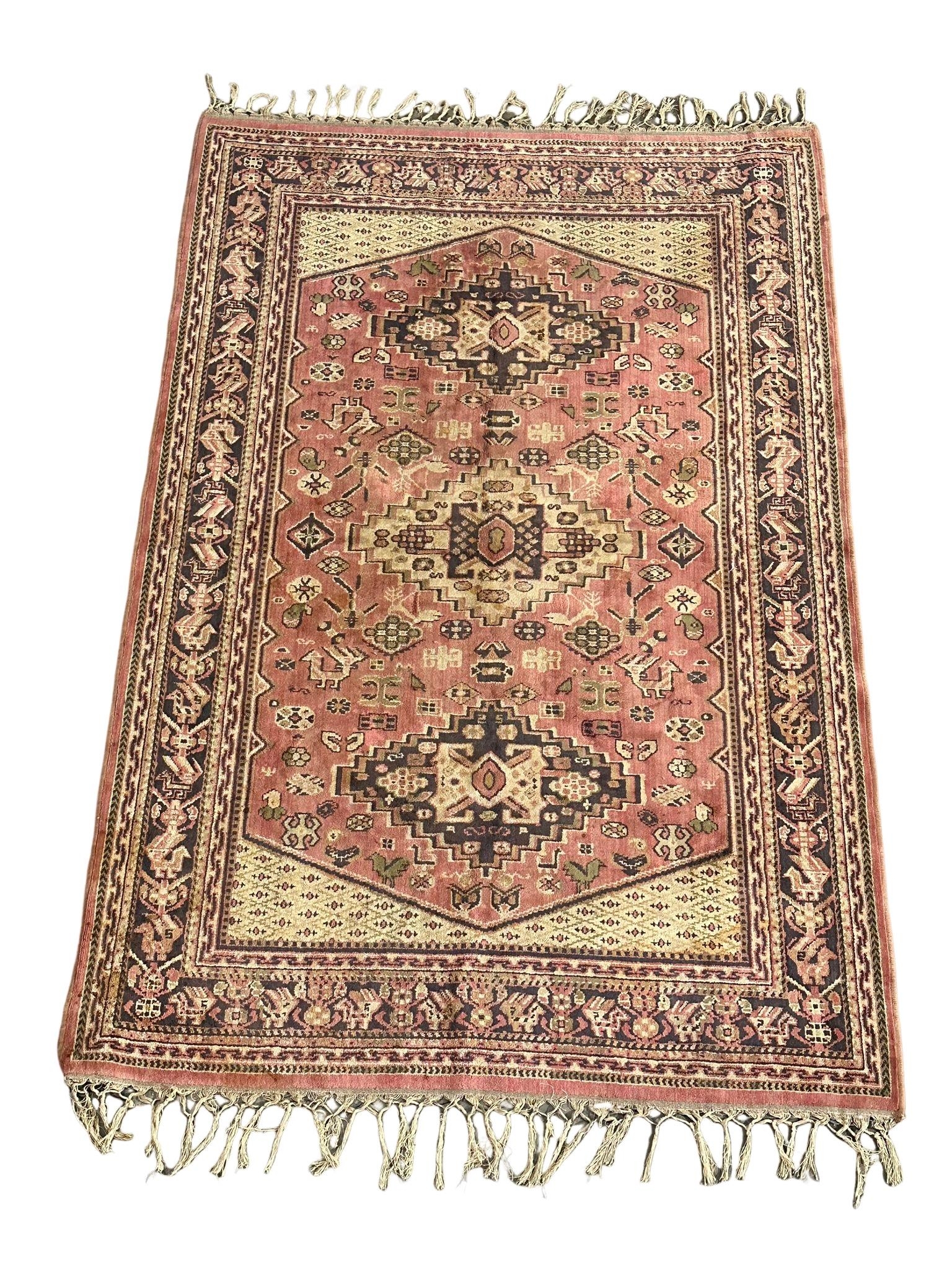 A vintage Middle Eastern hand knotted rug. 130x220cm