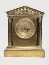 A large late 19th century French brass mantle clock by AD Mougin Deux Medailles. With pendulum. 28.