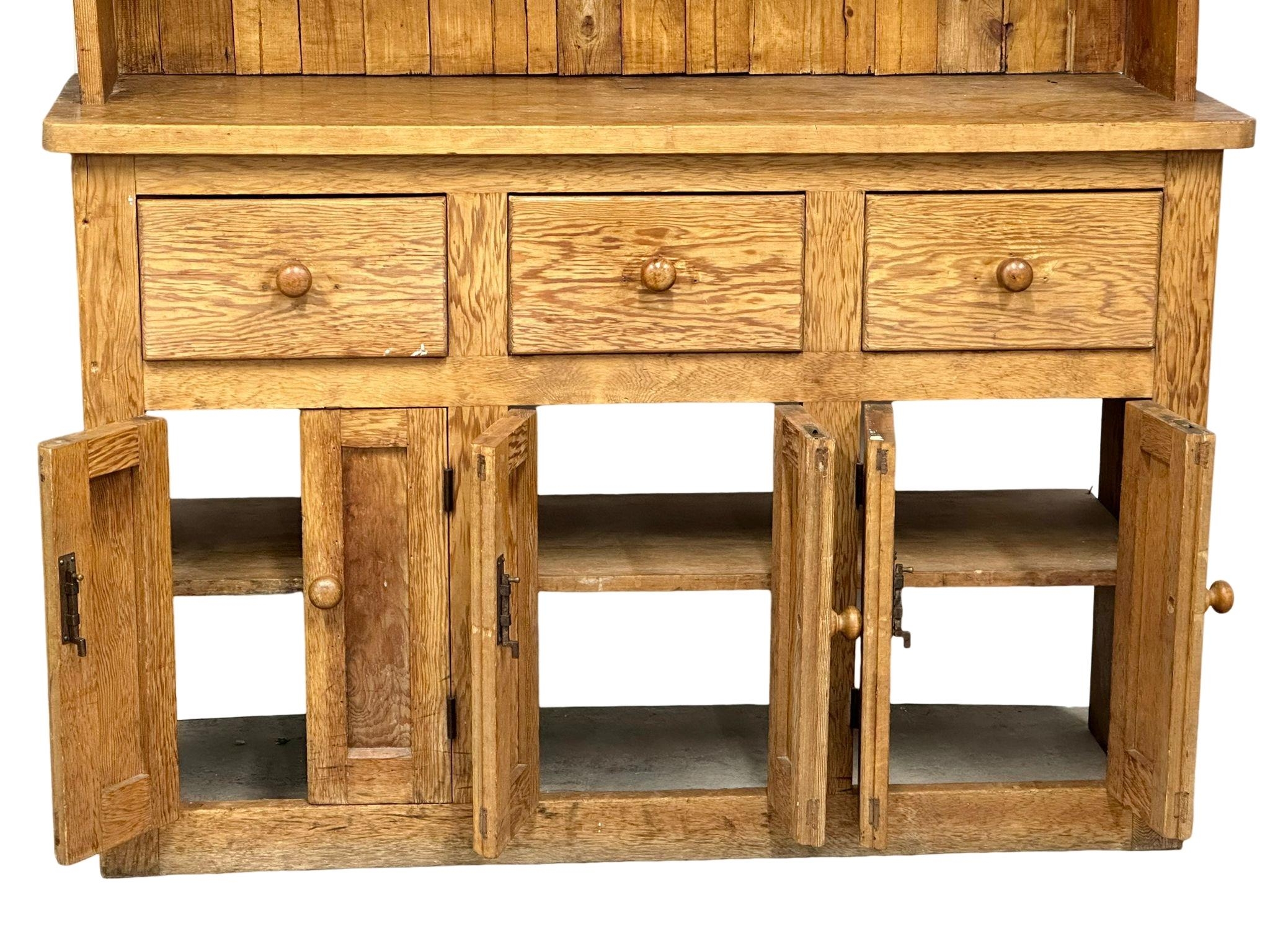 A large Late 19th Century Victorian pine kitchen dresser. 144x48x221cm - Image 6 of 8