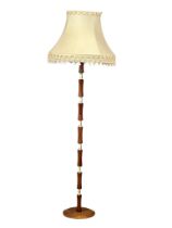 A Mid Century teak standard lamp. 174cm