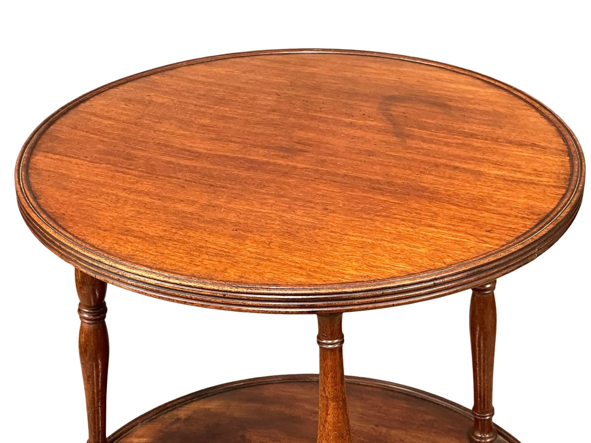 A George III mahogany revolving pedestal dumbwaiter with reeded column and brass cup casters, - Image 2 of 4