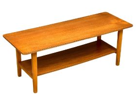 A Mid Century teak 2 tier coffee table, 121cm x 44.5cm x 45cm