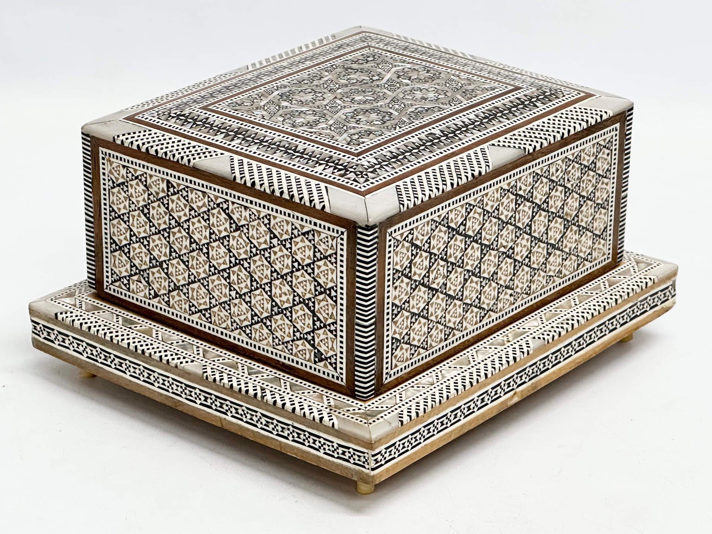 A Mother of Pearl inlaid musical cigarette box. 19x17x11cm - Image 2 of 5