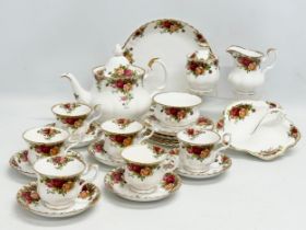 A 24 piece Royal Albert ‘Old Country Roses’ tea service. With teapot, cake plate, sugar bowl,