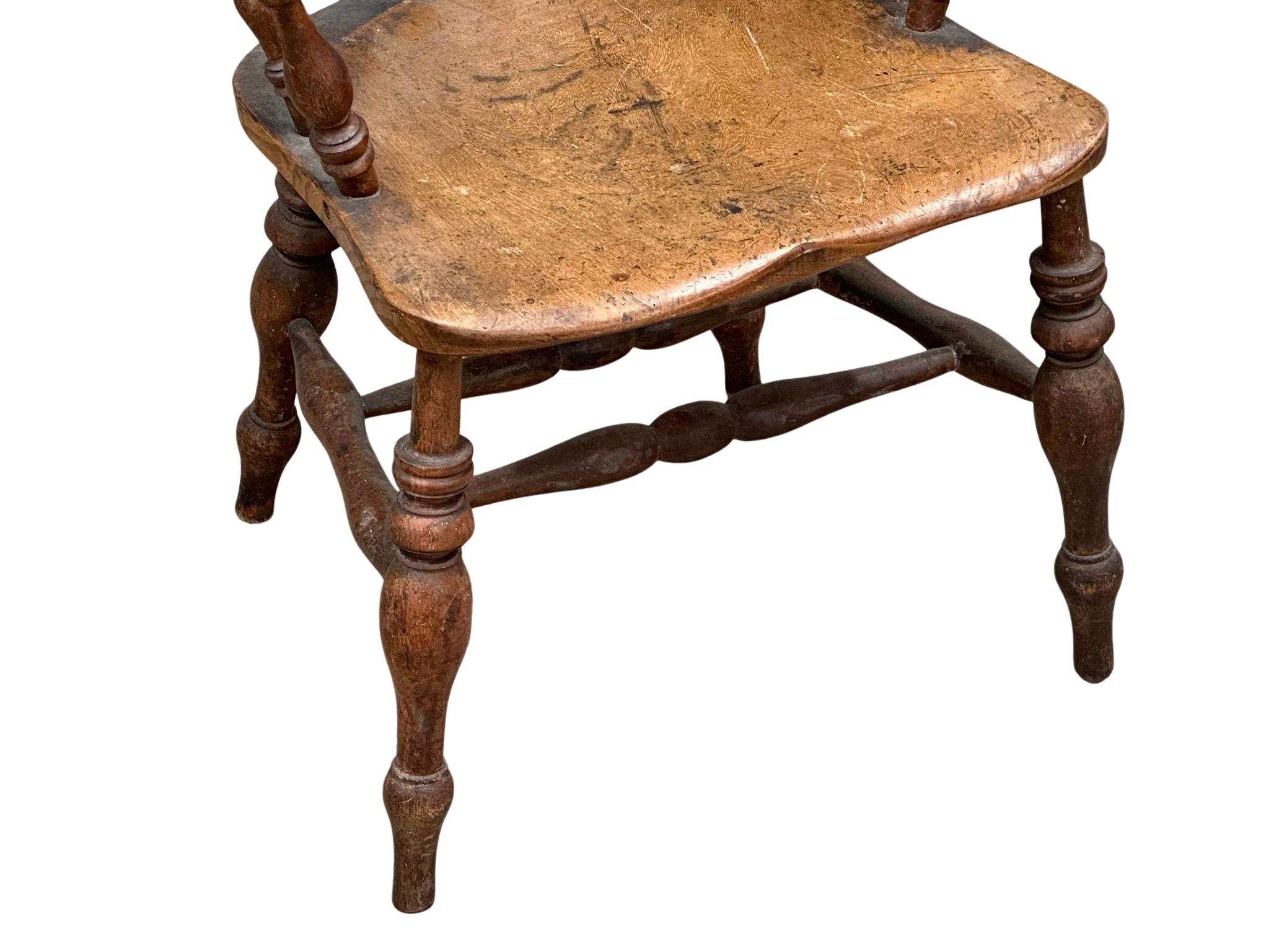 A Mid Victorian elm and beech elbow chair. - Bild 3 aus 3
