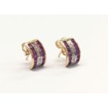 A pair of 9ct gold, ruby and diamond earrings. 1.47g