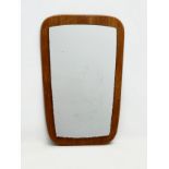 A Mid Century teak framed mirror. 38x60cm