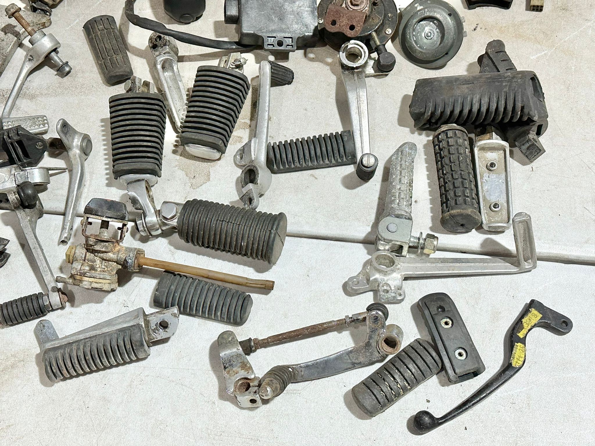 A sundry lot of various motorbike electrical parts with foot rests etc - Image 13 of 14